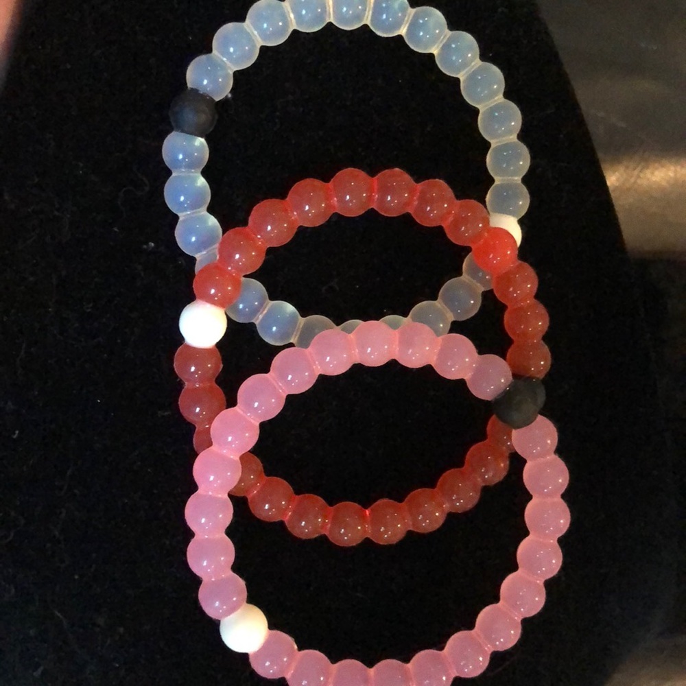 Three Lokai bracelets